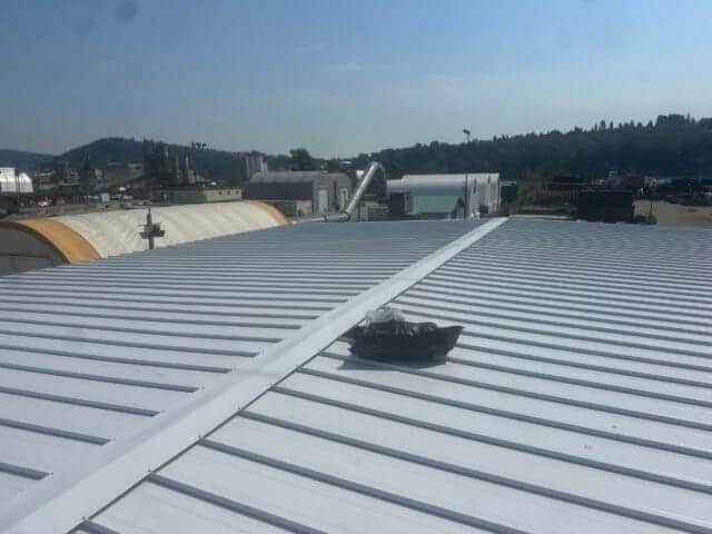 industrial roofing contractors in North Vancouver installing metal roof system